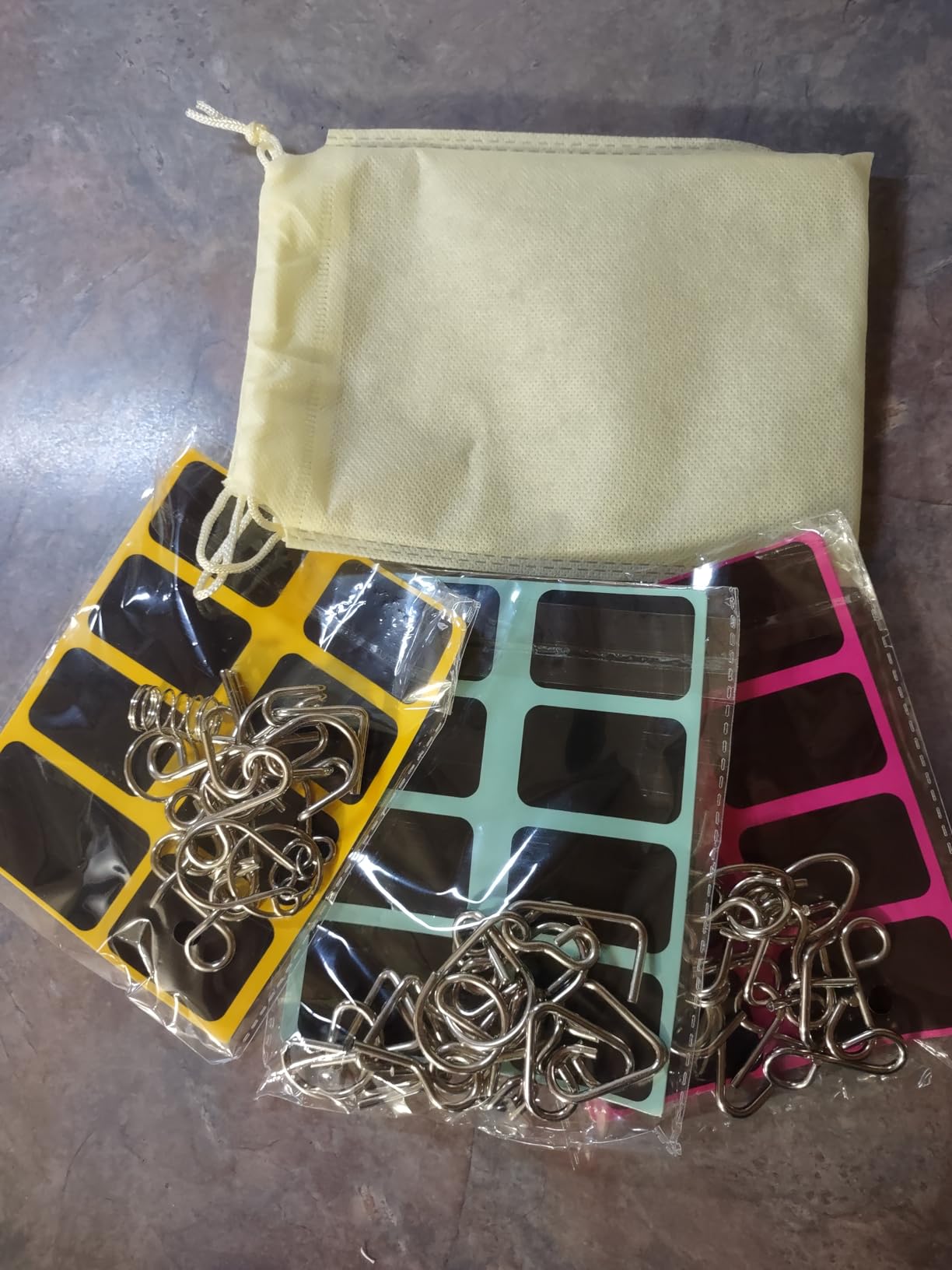 Metal Wire Puzzle Set of 24 with Pouch, Brain Teaser IQ Test Disentanglement Iron Link Unlock Interlock Game Chinese Ring Magic Trick Toy for Party Favor Kids Adults Challenge customer photo 1