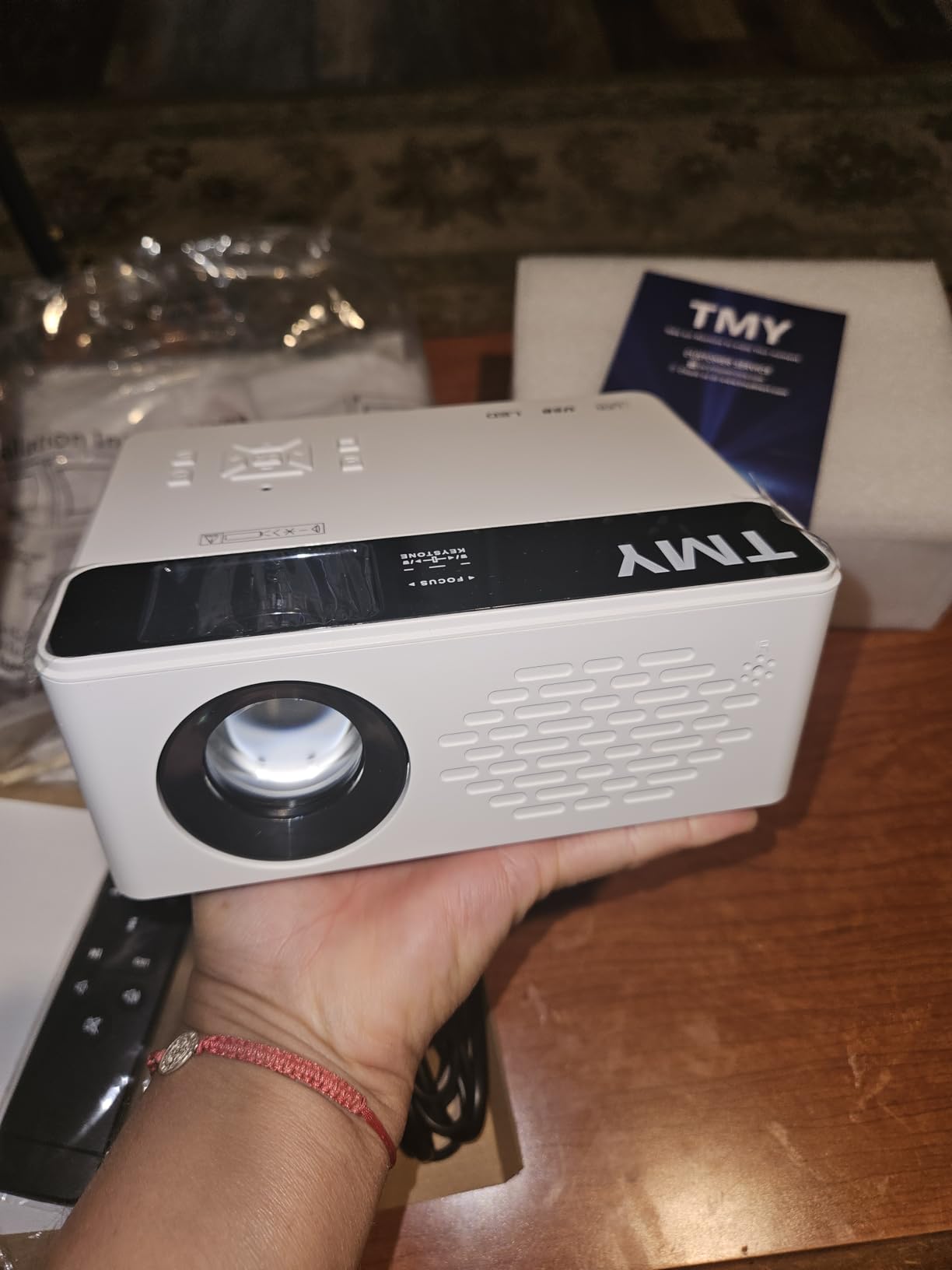 TMY 1080P Full HD Portable Mini Projector, Bluetooth Movie Projector, Compatible with TV Stick/Smartphone/PC/Game Console/HDMI/USB, Indoor & Outdoor Use, with Projector Screen customer photo 1