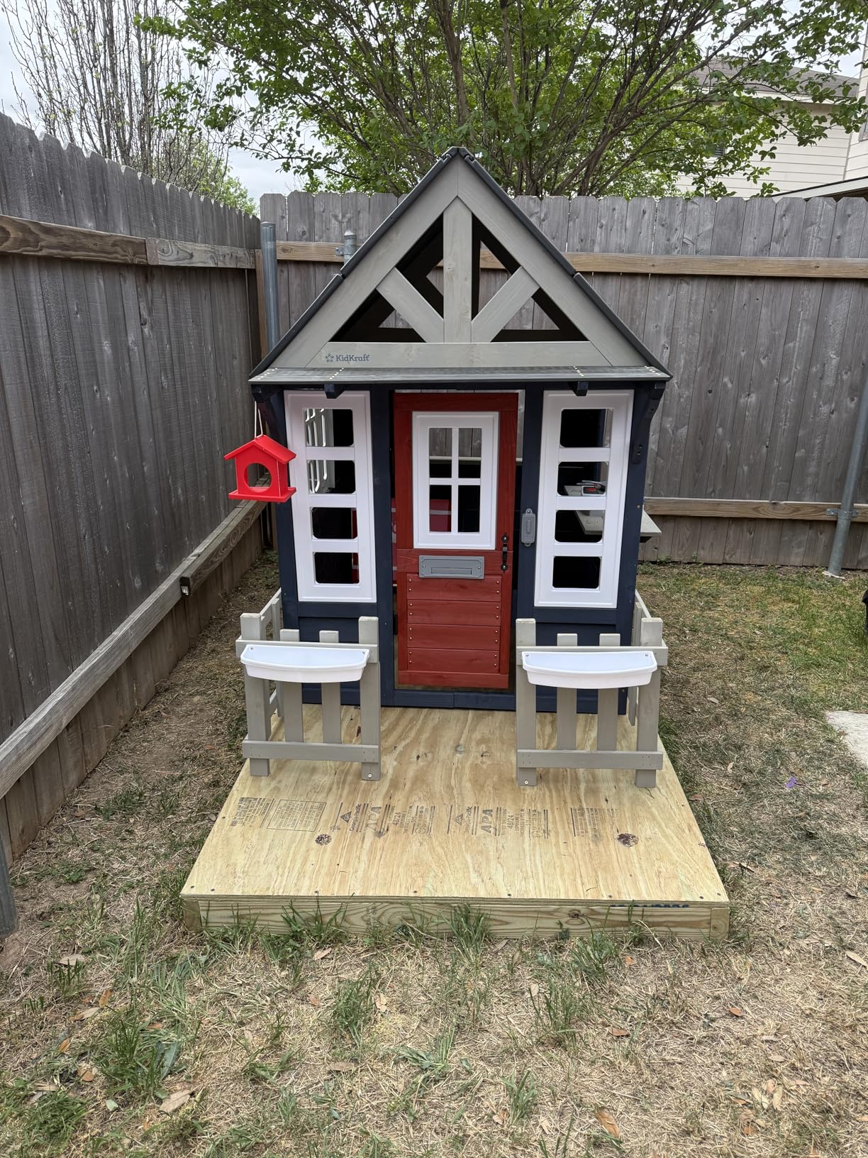 KidKraft Riverscape Wooden Playhouse with Working Doorbell, Fence, Kitchen, Pet Door, Chalkboards and Planters customer photo 2