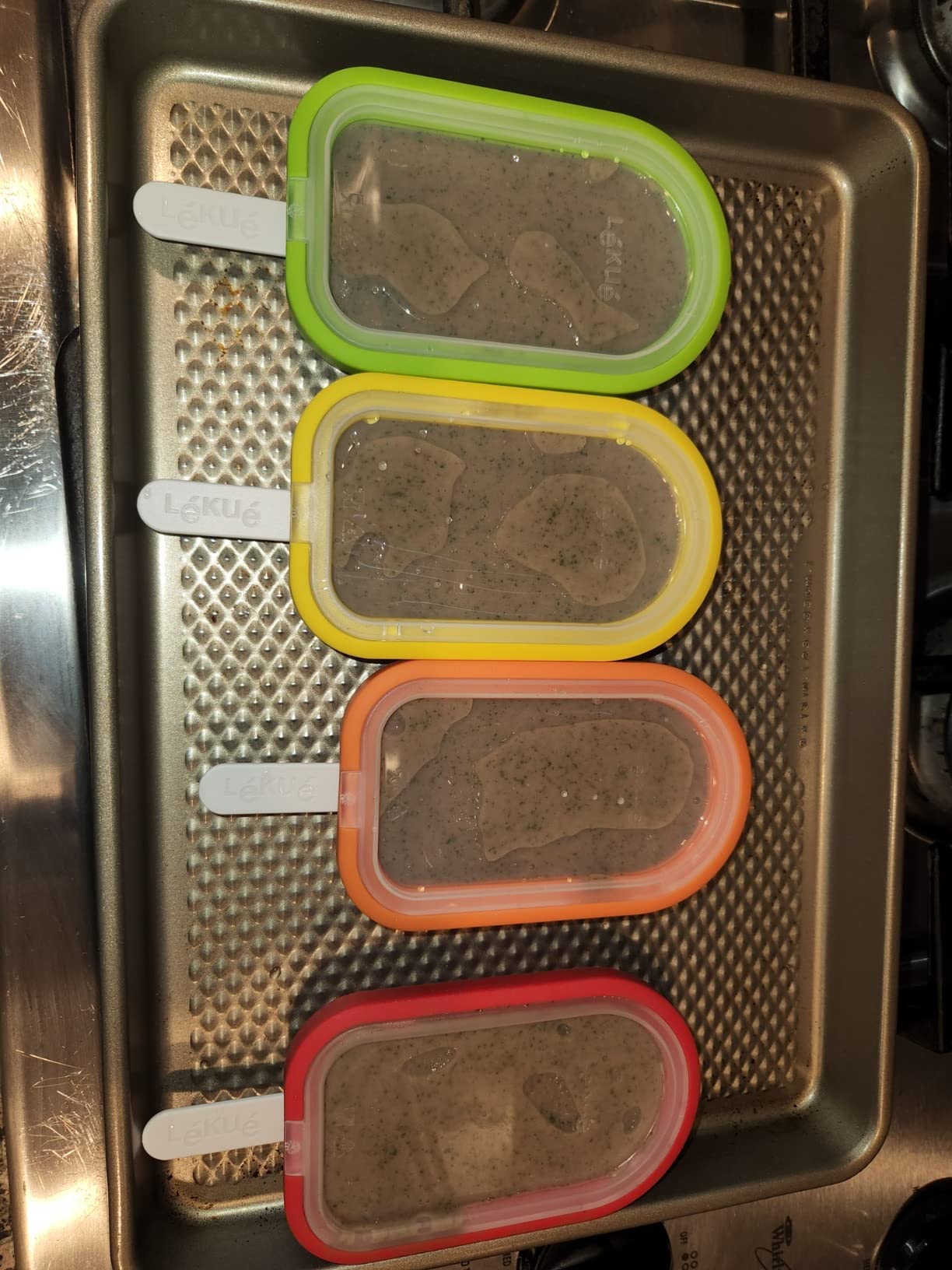 Lékué Set of 4 Stackable Popsicle Molds + Sticks & Lids | Homemade Freezer Ice Pops & Frozen Snacks | Flexible Platinum Silicone for Easy Fill & Unmold | Reusable & Dishwasher Safe| Multicolor customer photo 1