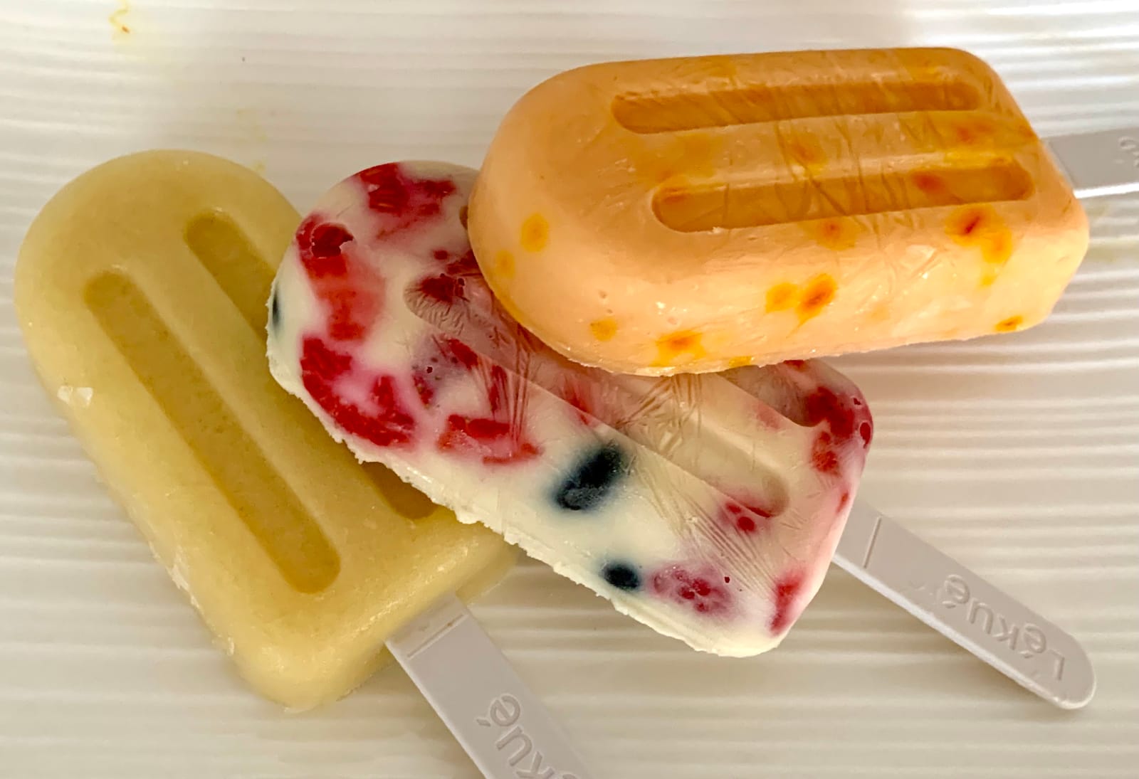 Lékué Set of 4 Stackable Popsicle Molds + Sticks & Lids | Homemade Freezer Ice Pops & Frozen Snacks | Flexible Platinum Silicone for Easy Fill & Unmold | Reusable & Dishwasher Safe| Multicolor customer photo 2