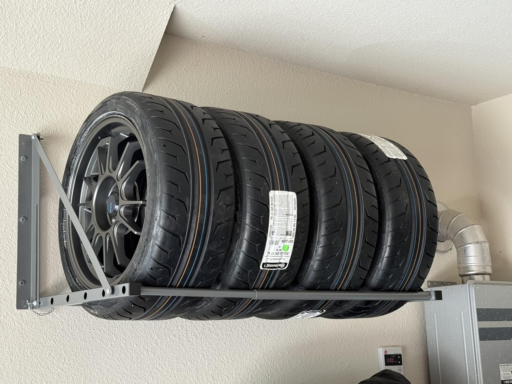 MaxxHaul Adjustable Wall Mount Folding Tire Rack – 32 to 48 Inch Width – 300 lb Capacity – Heavy Duty Steel Garage Tire Storage Holds 4 Tires – 70489 customer photo 1